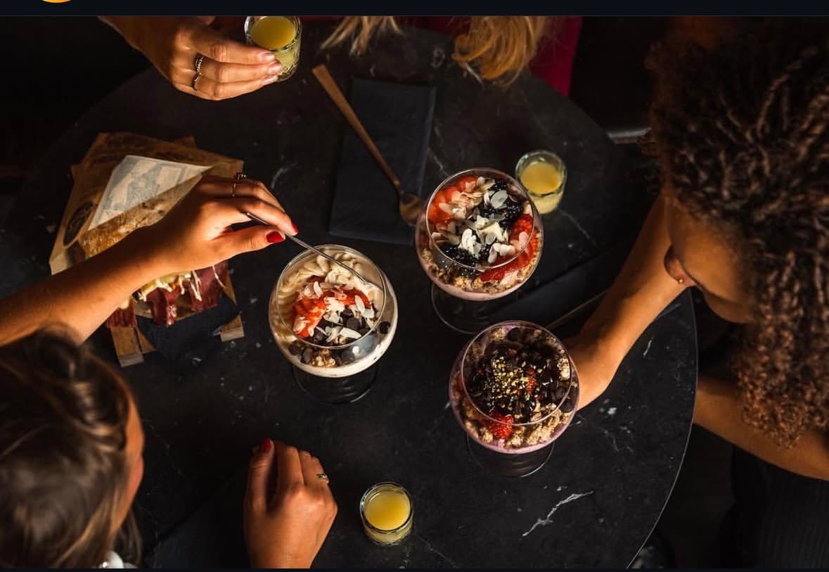 Guests sharing smoothie bowls together at The Smooth Brothers